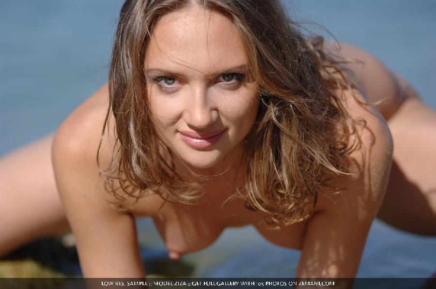 Cheerful Ziza gets naked on the sand near the sea - 14
