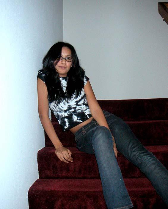 Brunette removes her jeans on stairs - 3