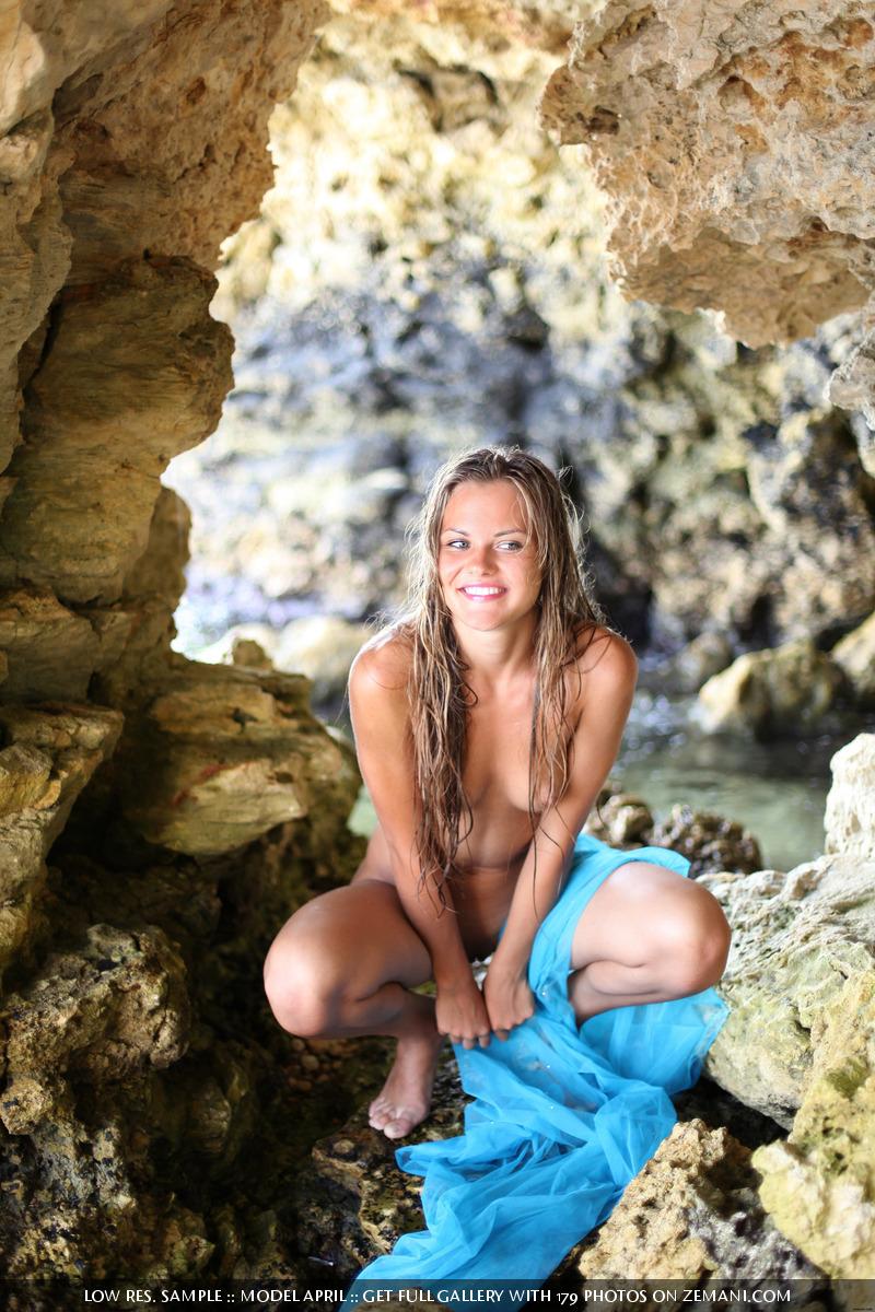 Nude girl with a great wet body on the sea stone - April - 7