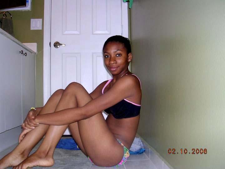 Ebony teen is posing on the floor - 2