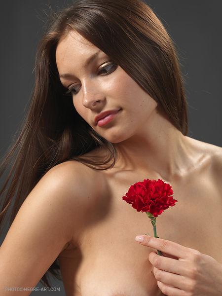 Elvira is posing with red flower - 1