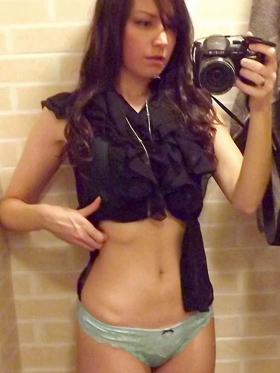 Brunette takes pics in bathroom - 1