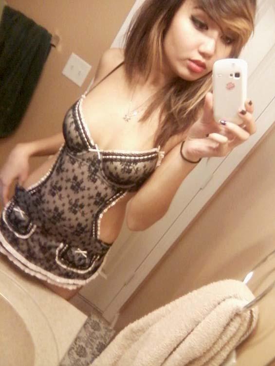 Adorable Asian girl and her selfies in bathroom - 1