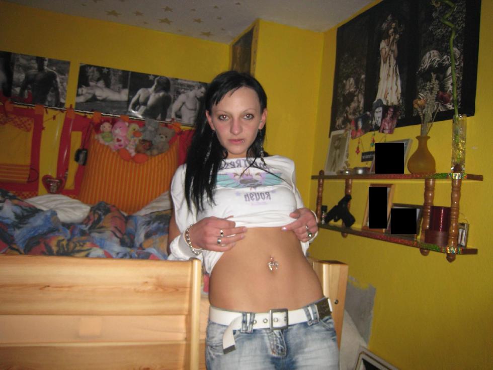 Brunette with big tattoo is posing on bed - 1