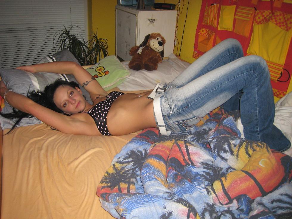 Brunette with big tattoo is posing on bed - 4
