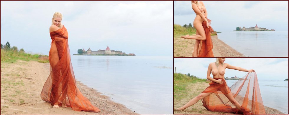Stunning blonde girl is posing on the beach - Berry A - 63
