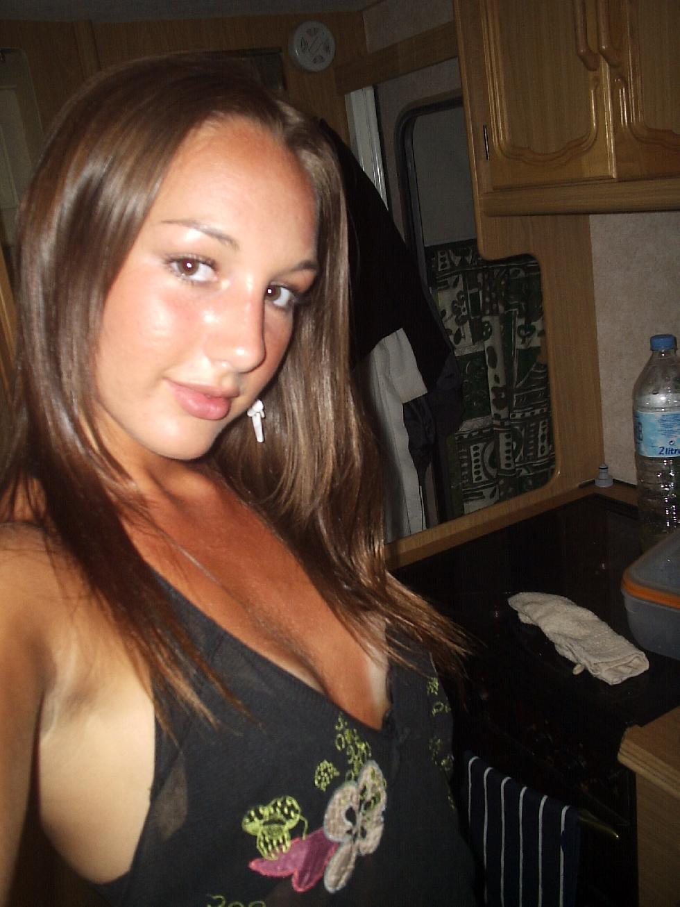 Tanned young girl is posing at home - 1