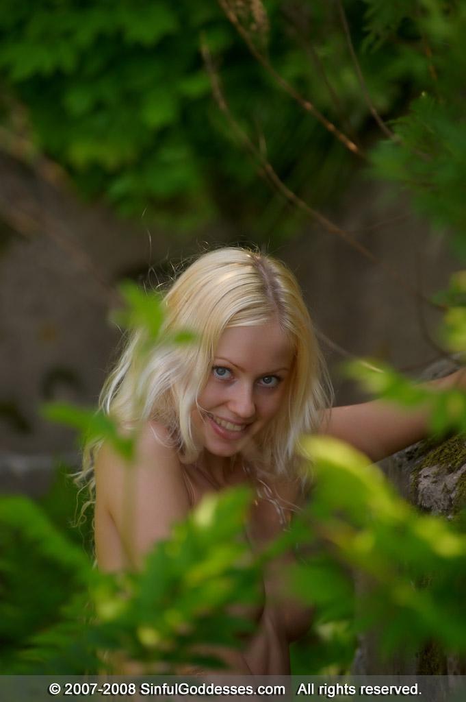 Long-haired blonde is posing naked in the woods - Silvia - 13