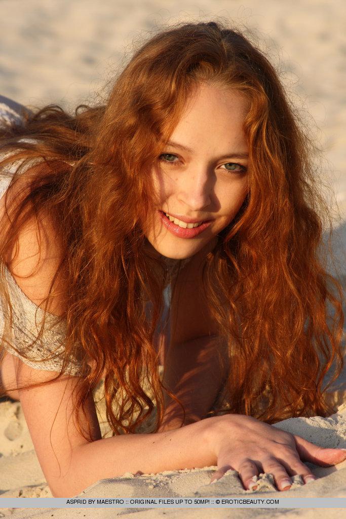 Redhead Asprid is relaxing on the beach - 1