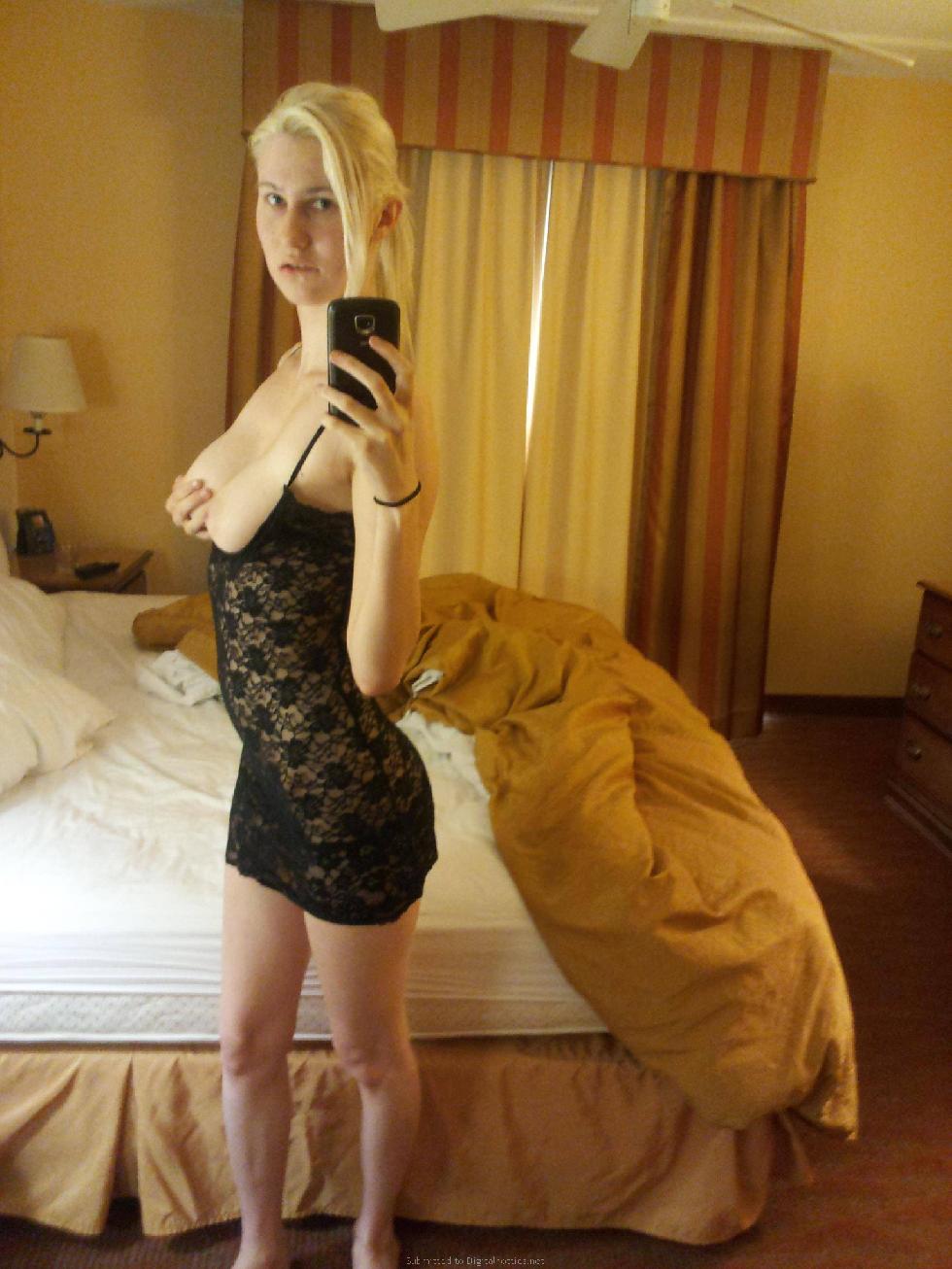 Sexy blonde girl is posing in a hotel room - 4