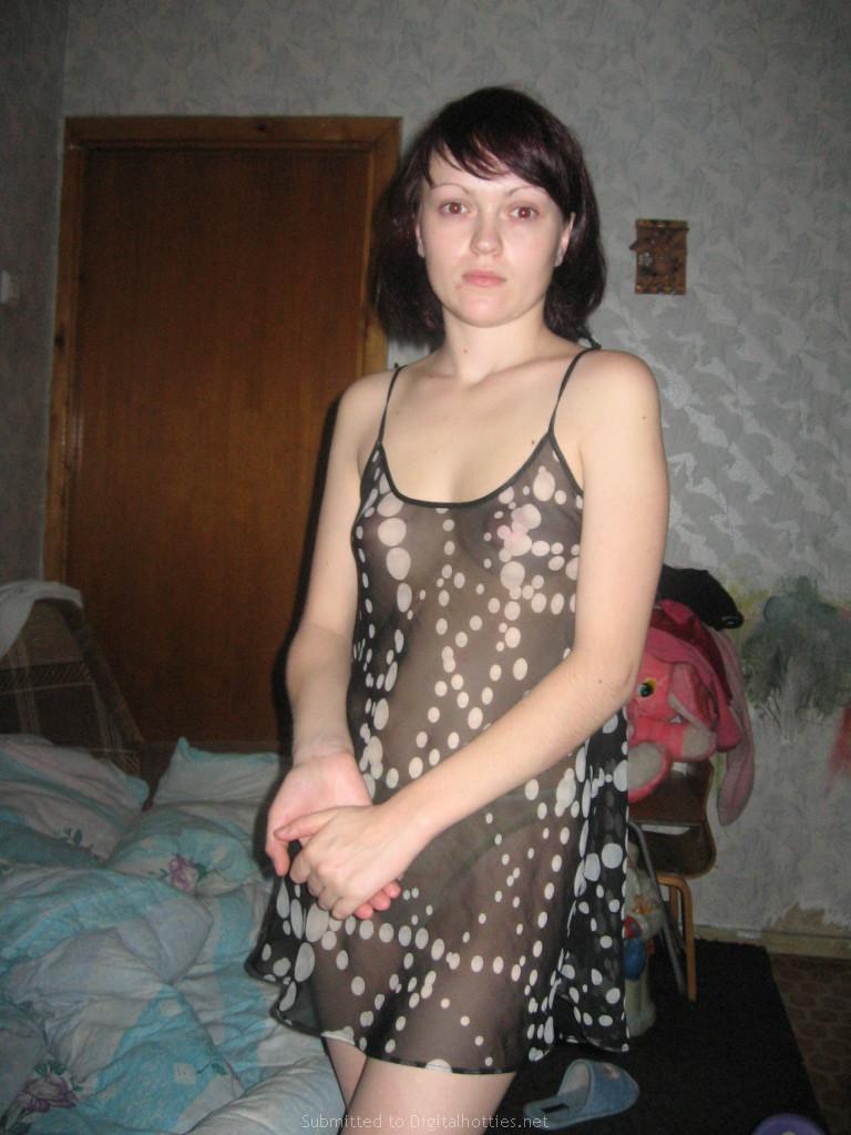 Cute brunette is posing at home - 1