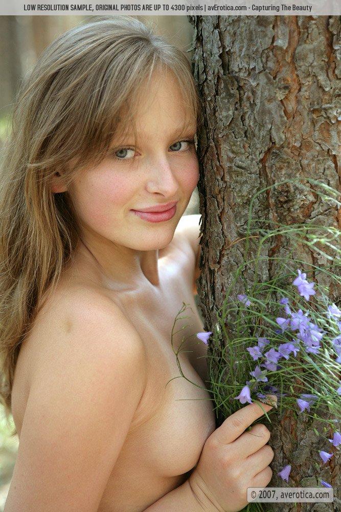 Shy Nusia is stripping in a forest - 8