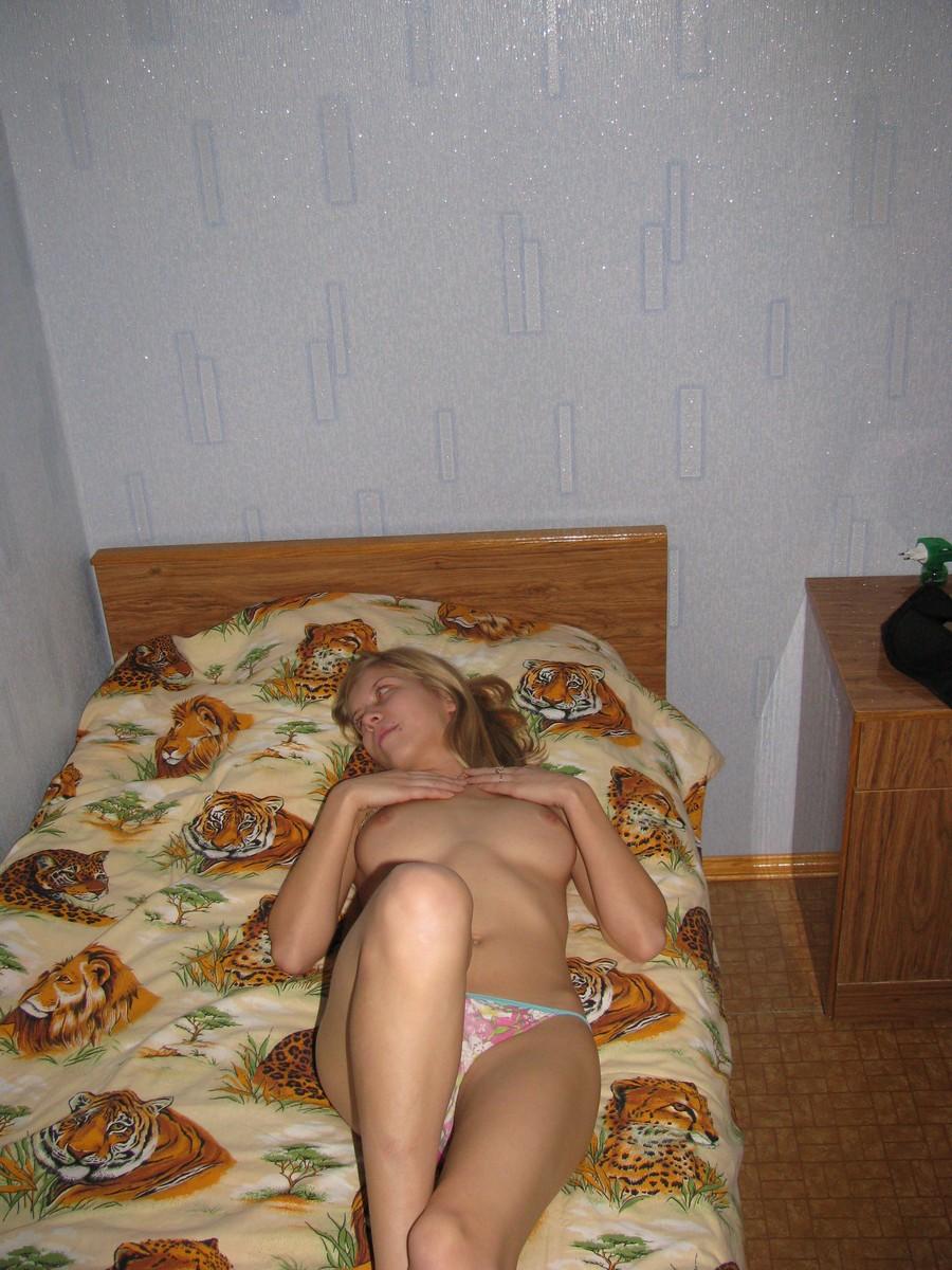 Blonde girl is posing in panties on her bed - Ira - 1