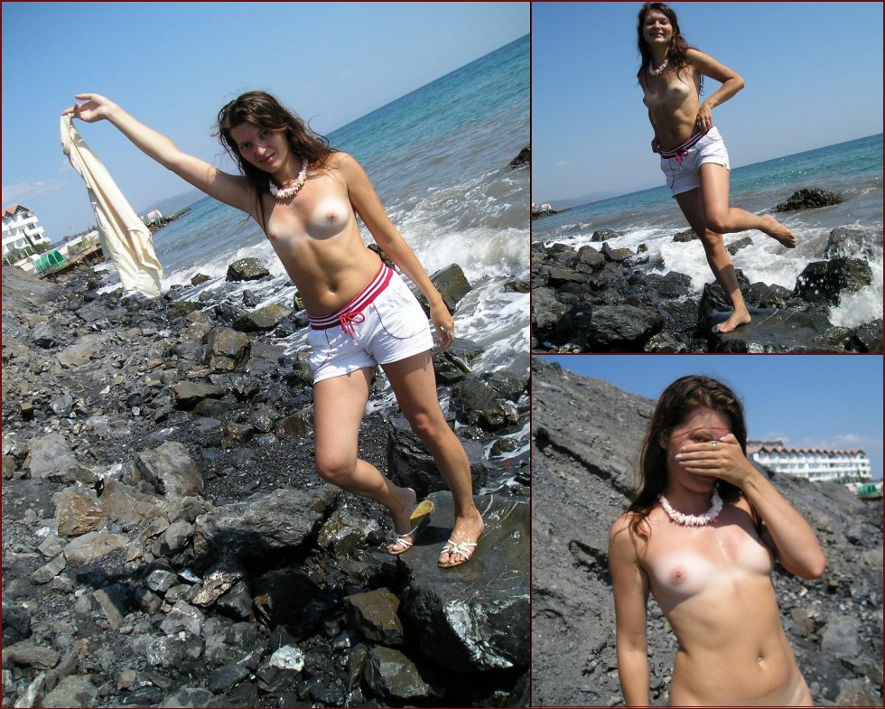 Larisa is posing naked on a rocky beach - 13