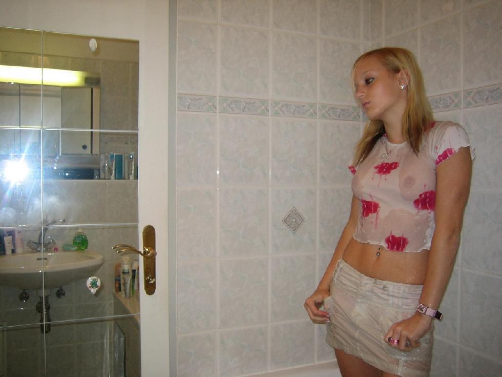 Cute teen girl is taking a shower - 1