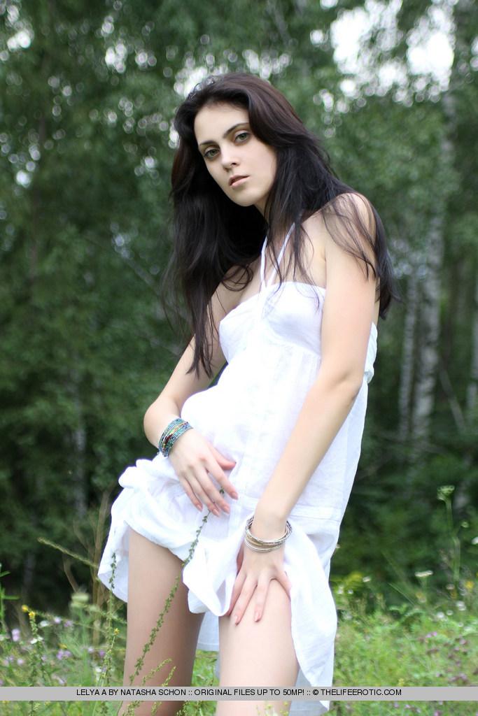 Charming Lelya is stripping on the meadow - 2