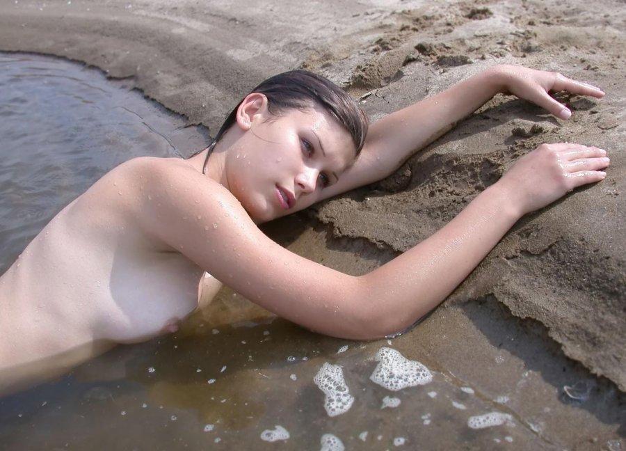 Naked, young girl on the beach - 7