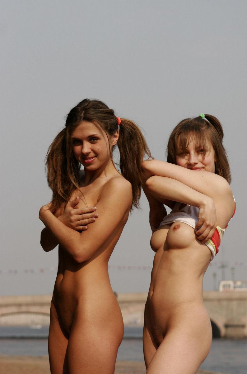 Two beautiful and young girls in public place - 2