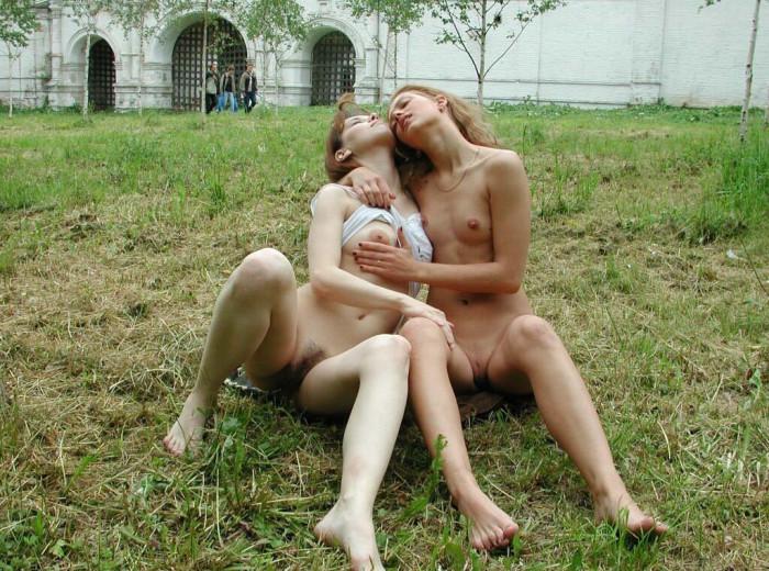 Two young girls are touching in the park - 8