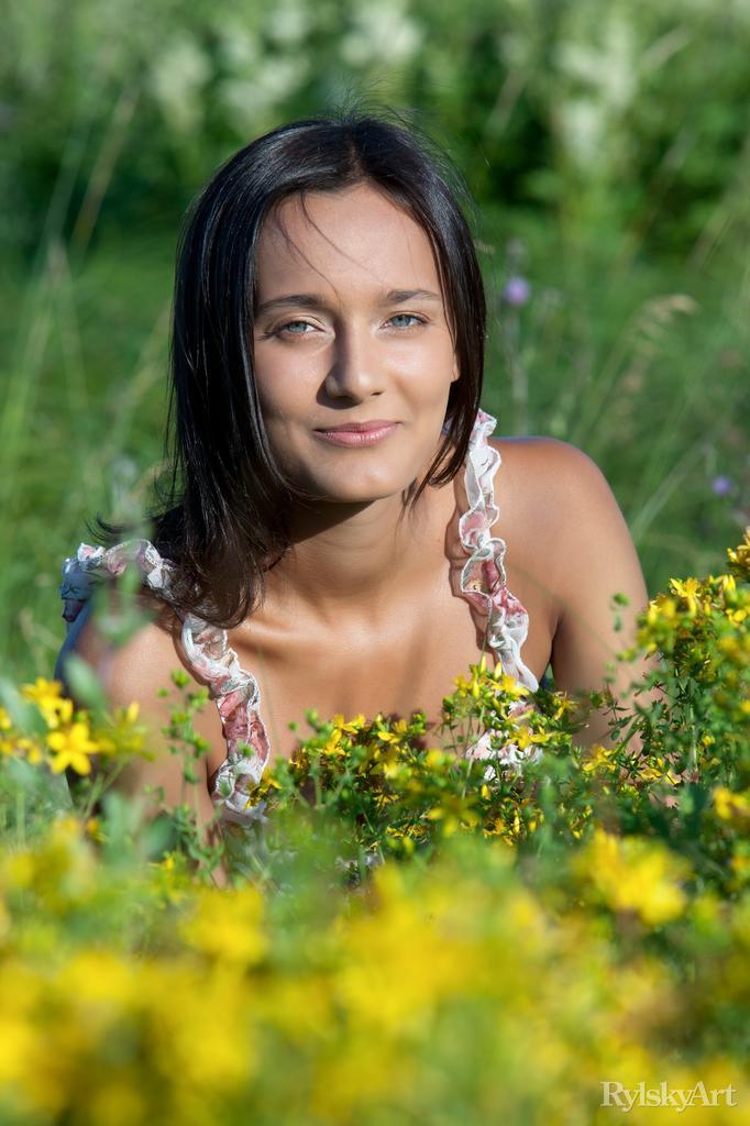 Charming brunette is posing on the meadow - Chandra - 1