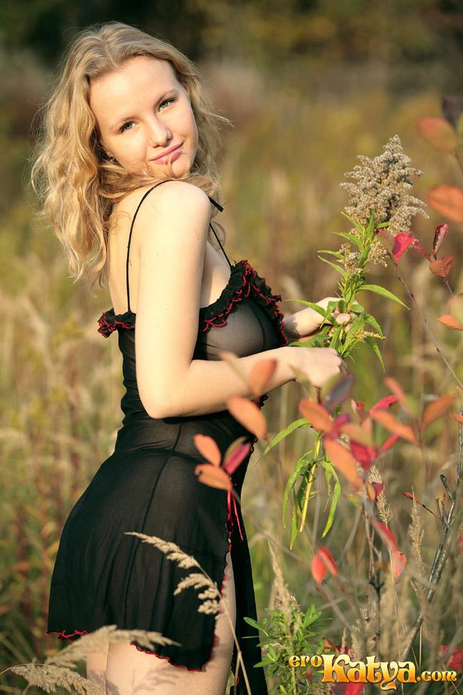 Young Katya is posing on the meadow - 2