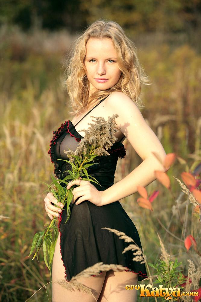 Young Katya is posing on the meadow - 3