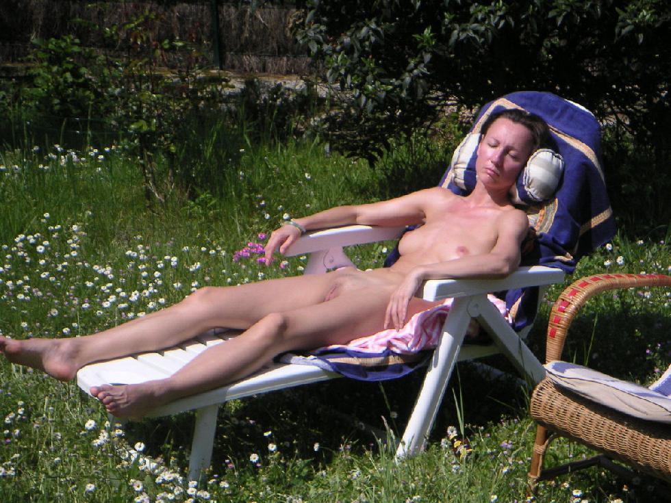 Sexy MILF is taking a sunbath on the backyard - 6