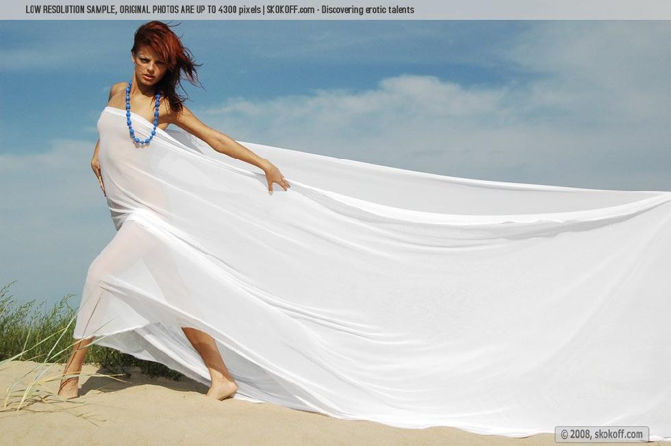 Sensual redhead is tempting on the beach - Mary