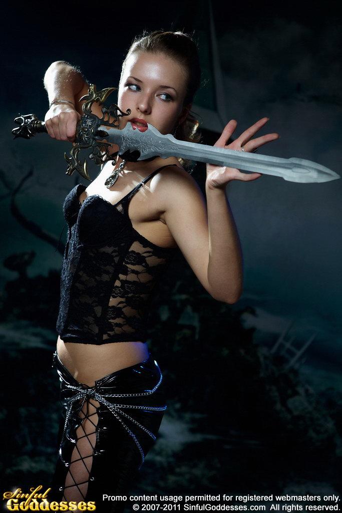 Stunning Agneta is posing with big sword. Part 1 - 4