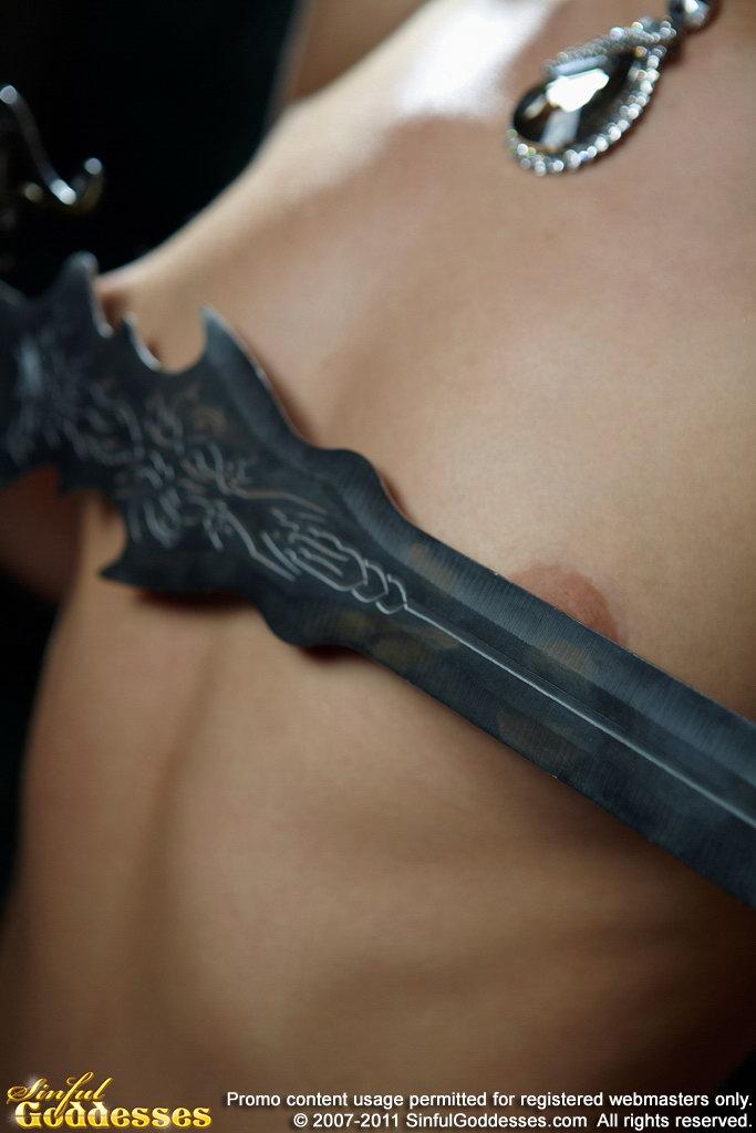 Stunning Agneta is posing with big sword. Part 1 - 7