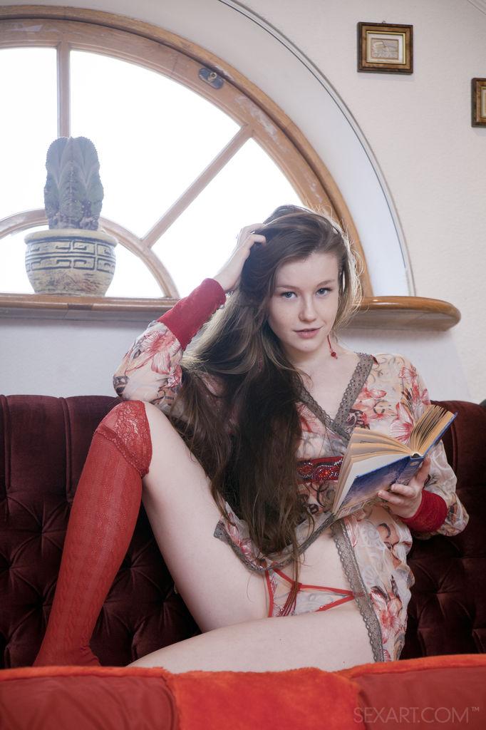 Fantastic Emily Bloom is posing on the sofa - 1