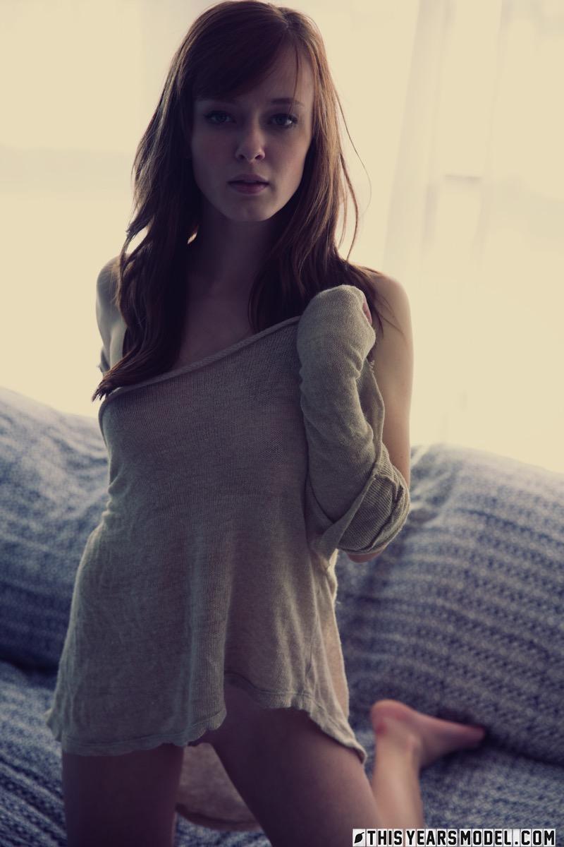 Red-haired Ellie Jane is tempting on the sofa - 1