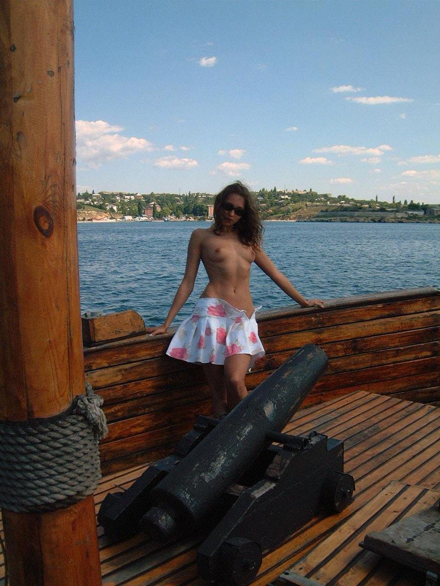 Young Julia is posing on the old boat. Part 1 - 4