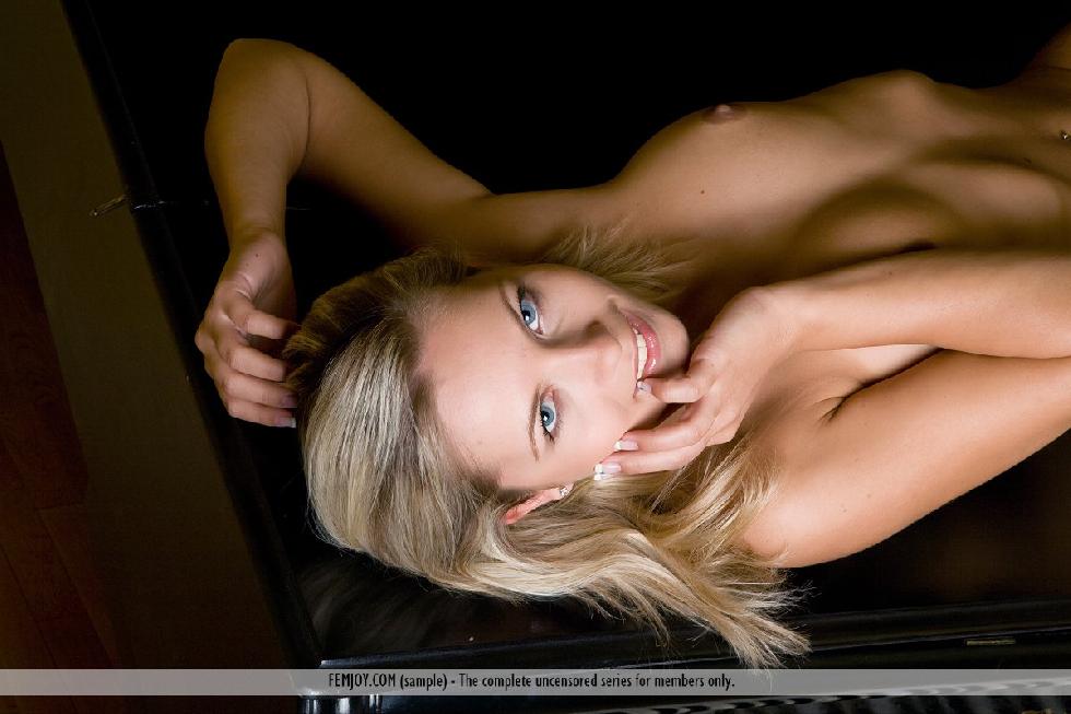 Blue-eyed blonde poses naked on the piano - Jenni - 2