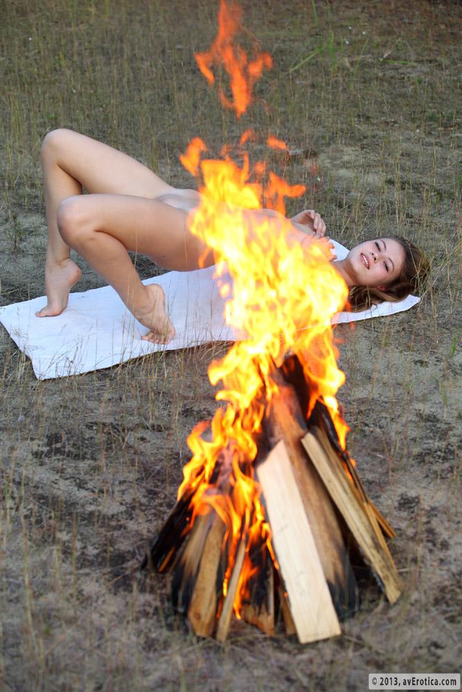 Amy poses naked by the fire - 13