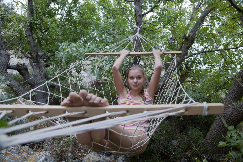 Young teen is relaxing on the hammock - Milena - 4