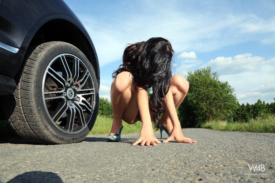 Gorgeous young Nika is posing on the road